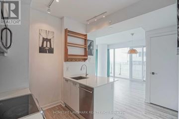 Toronto (Church-Yonge Corridor) condo for rent - A kitchen with a sink and a fridge.