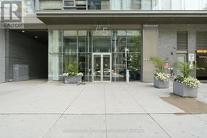 Toronto (Waterfront Communities) condo for rent - The front of a building with the sign "REALTOR" on it.