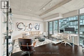 Toronto (Waterfront Communities) condo for rent - A modern office space with a large window overlooking the city.