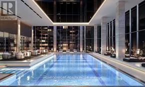Toronto (Waterfront Communities) condo for rent - A large indoor swimming pool in a modern building.
