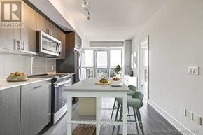 Oshawa (Windfields) condo for rent - A modern kitchen with a dining table and chairs.