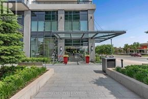 Mississauga (City Centre) condo for rent - The image shows the front of a modern building with a glass facade and a covered walkway leading to the entrance.