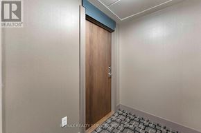 Mississauga (City Centre) condo for rent - A room with a wooden door and a tiled floor.