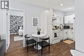 Chatham apartment for rent - A kitchen with a table and chairs in the middle of the room.