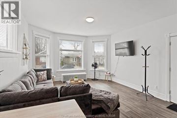 Chatham apartment for rent - A living room with a grey couch and a wooden coffee table.