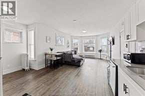 Chatham apartment for rent - A well-lit, spacious kitchen and living room with hardwood floors and white walls.