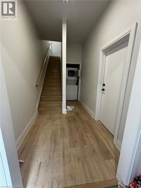 Hamilton apartment for rent - A room with a fireplace and a mirror on the wall.