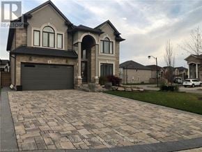 Hamilton (Carpenter) apartment for rent - A large house with a driveway in front of it.