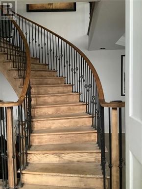 Hamilton (Carpenter) apartment for rent - A staircase with a black railing and wooden steps.