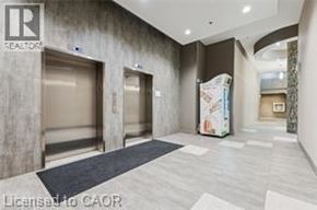Waterloo condo for rent - A hallway with a Realtor sign on the wall.