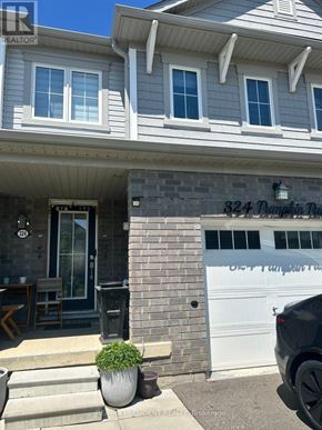 Hamilton (Binbrook) townhouse for rent - A house with a garage that has the number 324 on it.