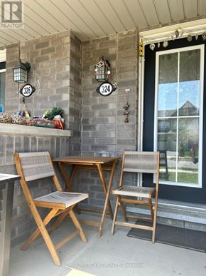 Hamilton (Binbrook) townhouse for rent - A small table with two chairs is on a porch.