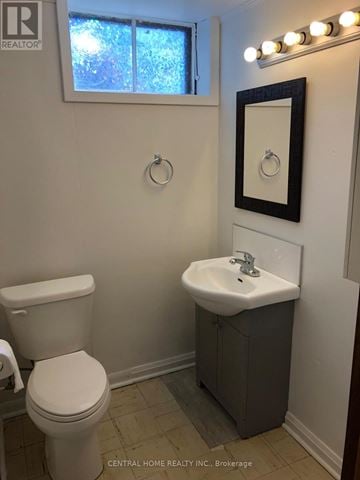 Oshawa (Lakeview) apartment for rent - A white toilet sits next to a sink in a small bathroom.