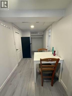 Vancouver apartment for rent - A small kitchen with a table and chairs.