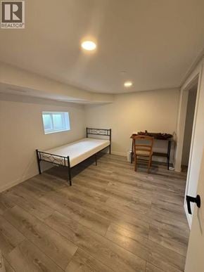 Vancouver apartment for rent - A bedroom with a bed, desk, and chair.