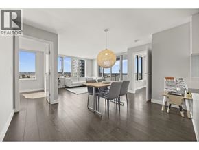 New Westminster apartment for rent - A modern dining room with a wooden table and grey chairs.