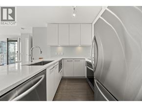New Westminster apartment for rent - A modern kitchen with white cabinets and a sleek design.