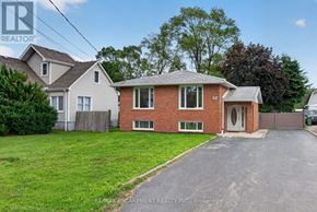 Hamilton (Fruitland) apartment for rent - A house with a red brick exterior and a white garage door is for sale.