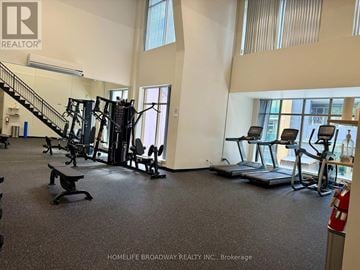 Toronto (Annex) condo for rent - A gym with a variety of equipment including treadmills, weights, and a bench.