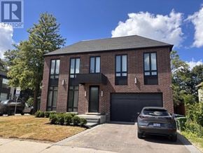 Toronto (Bedford Park-Nortown) apartment for rent - A house with a car parked in front of it.