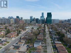 Toronto (Lansing-Westgate) apartment for rent - A cityscape with a mix of residential and commercial buildings.