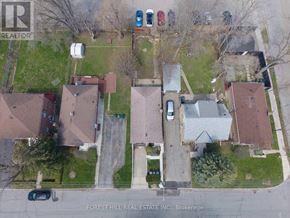Toronto (Lansing-Westgate) apartment for rent - An aerial view of a neighborhood with houses and cars.