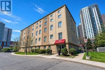 Toronto (Dovercourt-Wallace Emerson-Junction) condo for rent - A building with a red awning is located on a street corner.