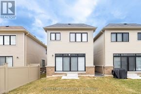 Clarington (Bowmanville) apartment for rent - A real estate photo of a house with a fence and a covered patio.
