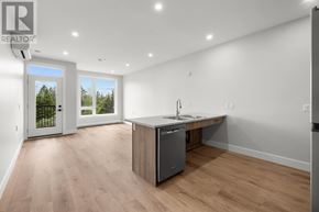 Charlottetown condo for rent - A modern kitchen with a sink and a dishwasher.