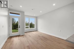 Charlottetown condo for rent - A room with a sliding glass door leading to a balcony.