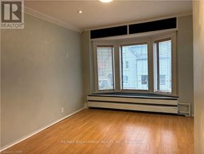 Hamilton (Kirkendall) apartment for rent - A room with a window and a wooden floor.