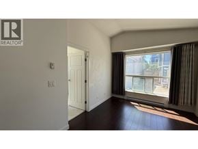 Coquitlam apartment for rent - A room with a door and a window with curtains.