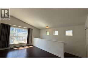 Coquitlam apartment for rent - A room with a window and a white wall.