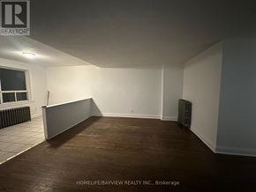 Toronto (Keelesdale-Eglinton West) apartment for rent - A room with a window and a radiator on the wall.