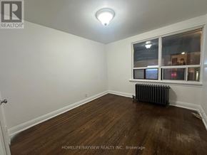 Toronto (Keelesdale-Eglinton West) apartment for rent - A room with a window and a radiator on the floor.