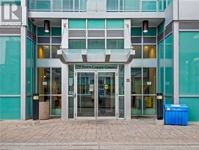 Toronto (Bendale) condo for rent - The entrance to a building with a glass door and a sign that reads "70 Town Centre Court".