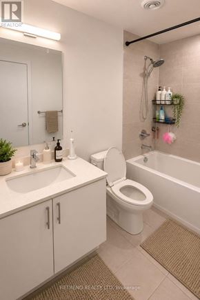 Toronto (Willowdale West) condo for rent - A white bathroom with a sink, toilet, and bathtub.