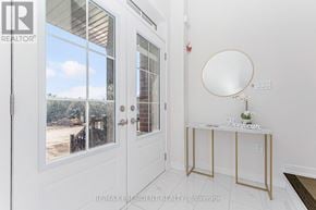 Erin apartment for rent - A white door with a glass window and a mirror on the wall.