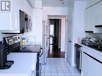 Toronto (Church-Yonge Corridor) condo for rent - A kitchen with white cabinets and a black coffee maker.