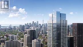 Toronto (North St. James Town) condo for rent - A cityscape with a realtor logo in the corner.