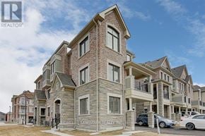Richmond Hill townhouse for rent - A large, multi-story residential building with a brick facade and multiple balconies.