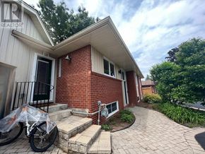 Oakville (Wo West) apartment for rent - A brick house with a bicycle in front.