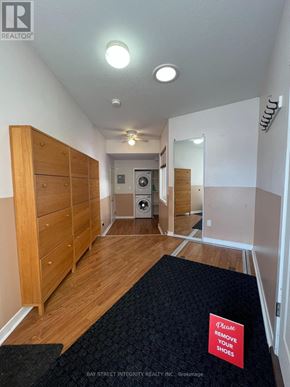 Oakville (Wo West) apartment for rent - A hallway with a sign that says "Please remove your shoes".