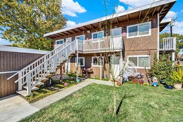 Fairfield apartment for rent - A house with a brown exterior and a white staircase leading to the second floor.