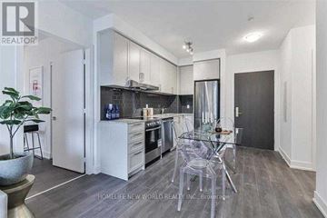 Markham (Unionville) condo for rent - A modern kitchen with a glass table and chairs.
