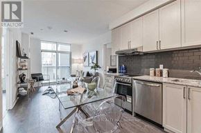Markham (Unionville) condo for rent - A modern kitchen with a glass table and stainless steel appliances.