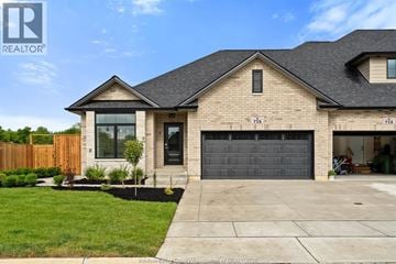 Amherstburg townhouse for rent - A house with a garage and a driveway in front.