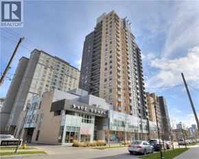 Waterloo condo for rent - A tall building with the words Sage Place on the front.