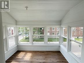 St. Thomas fourplex for rent - A sunny room with a view of the street outside.