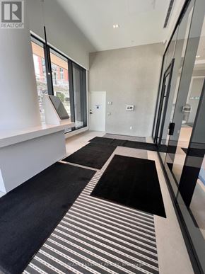 Burlington (Brant) condo for rent - A hallway with a black and white striped rug.